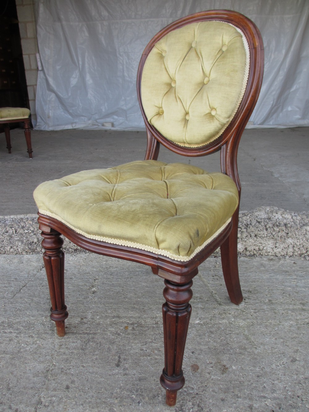 Set of 6 quality 19th century dining chairs. Button upholstered balloon backs with tapered reeded forelegs View III