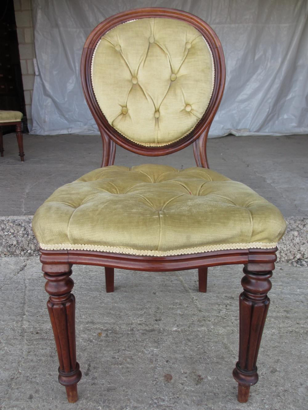 Set of 6 quality 19th century dining chairs. Button upholstered balloon backs with tapered reeded forelegs View IV