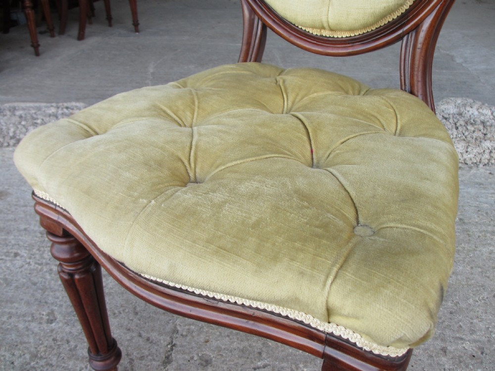 Set of 6 quality 19th century dining chairs. Button upholstered balloon backs with tapered reeded forelegs View VII