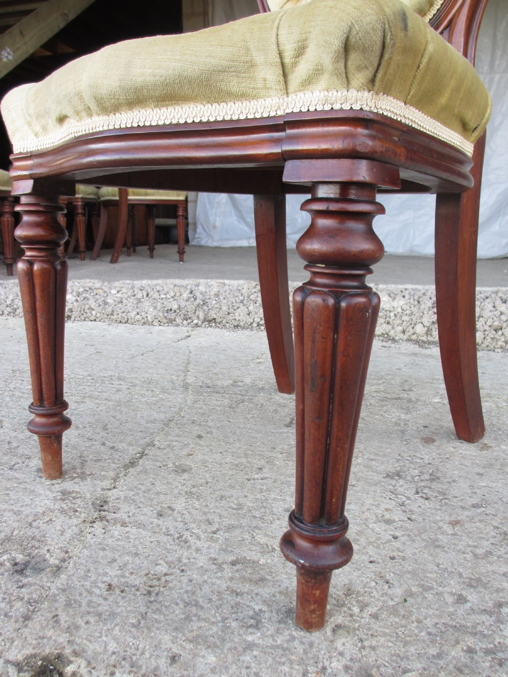Set of 6 quality 19th century dining chairs. Button upholstered balloon backs with tapered reeded forelegs View IX