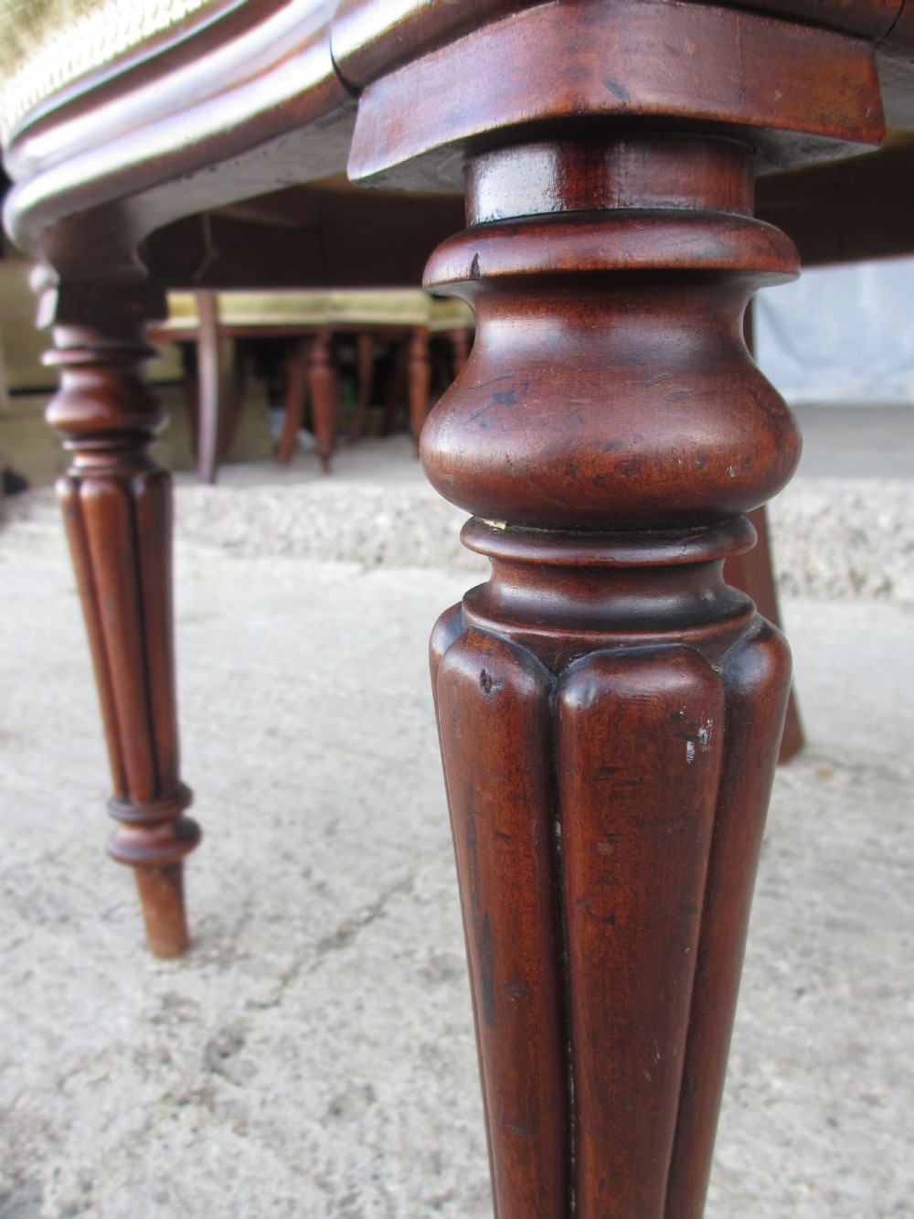 Set of 6 quality 19th century dining chairs. Button upholstered balloon backs with tapered reeded forelegs View X