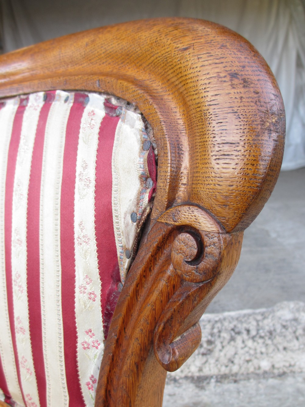 A pair of 19th-century oak balloon back dining chairs featuring red and cream striped upholstery, carved scroll details, and cabriole legs. View IV
