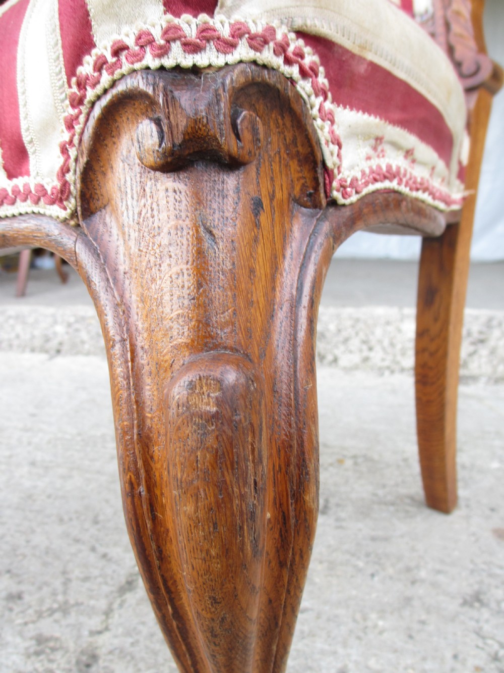 A pair of 19th-century oak balloon back dining chairs featuring red and cream striped upholstery, carved scroll details, and cabriole legs. View XIII