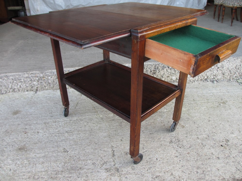 Oak extending tea trolley with cutlery drawer on castors C1920 View II