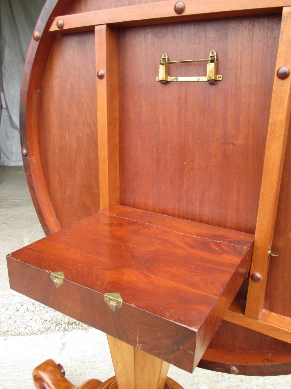 Victorian mahogany circular tilt top table with tripod scrolled legs on castors  View VI