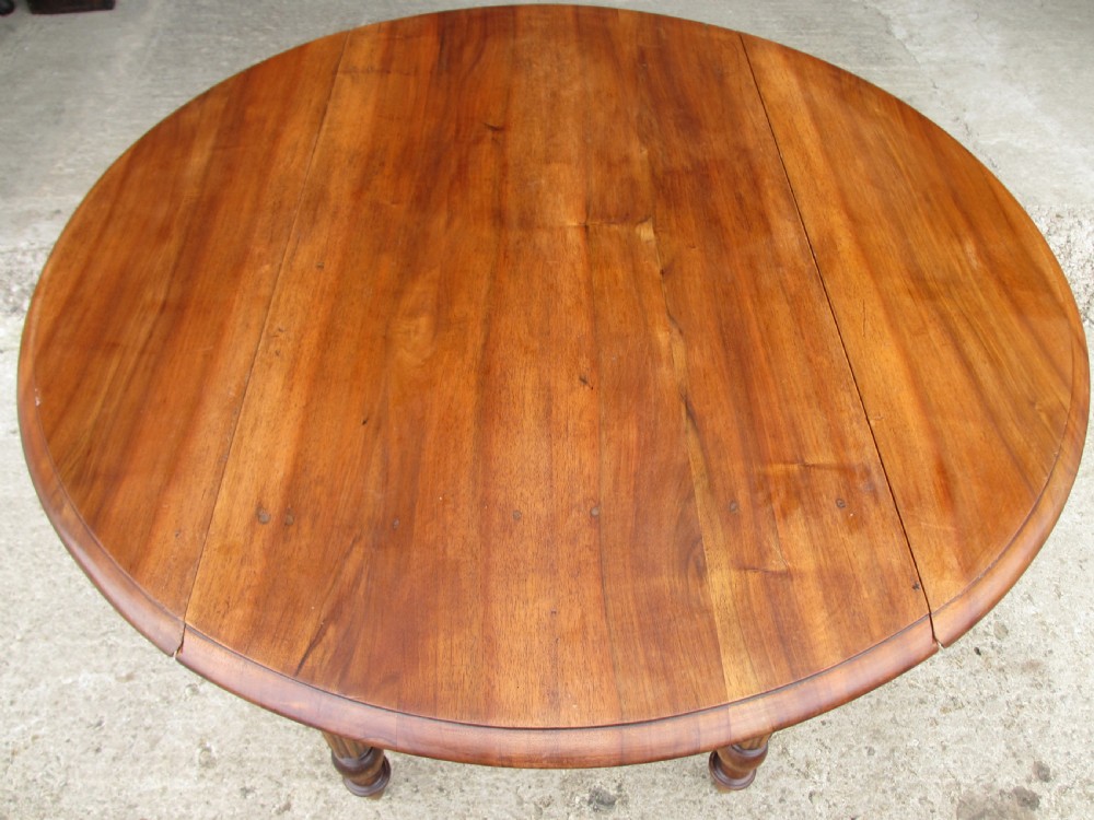 Victorian mahogany circular top drop leaf dining table turned reeded supports View V