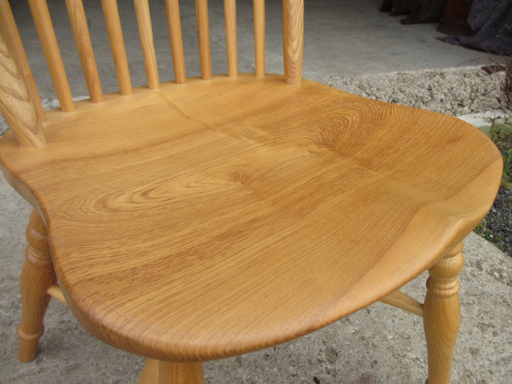 Set of eight stick back elm seated windsor dining chairs splayed supports curved stretcher c1920 View VI