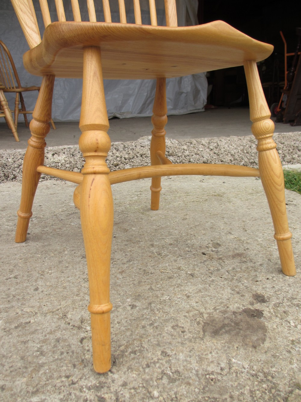 Set of eight stick back elm seated windsor dining chairs splayed supports curved stretcher c1920 View VIII