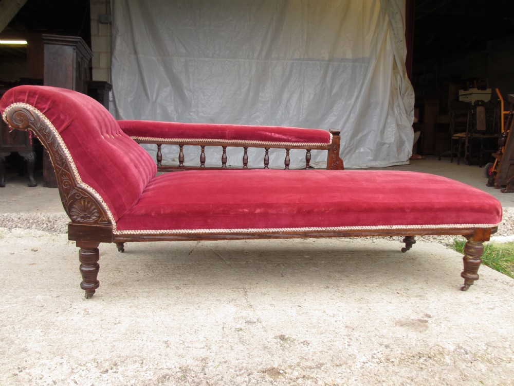 Victorian mahogany upholstered chaise longue turned supports and castors 