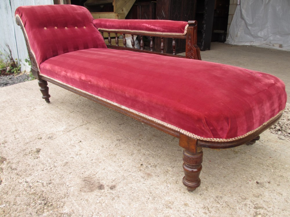 Victorian mahogany upholstered chaise longue turned supports and castors  View II