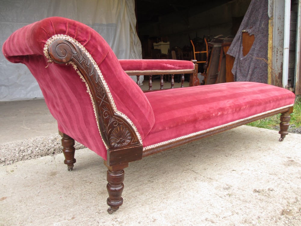 Victorian mahogany upholstered chaise longue turned supports and castors  View III