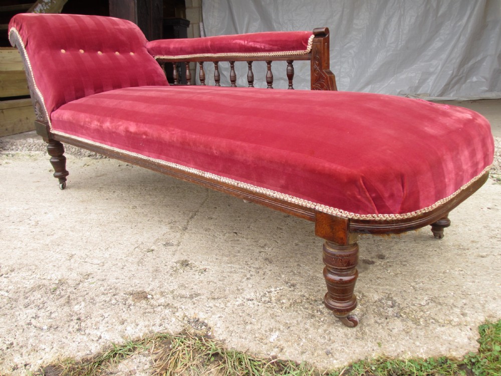 Victorian mahogany upholstered chaise longue turned supports and castors  View IV
