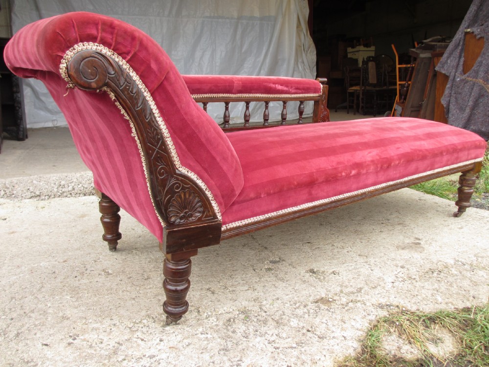 Victorian mahogany upholstered chaise longue turned supports and castors  View VI