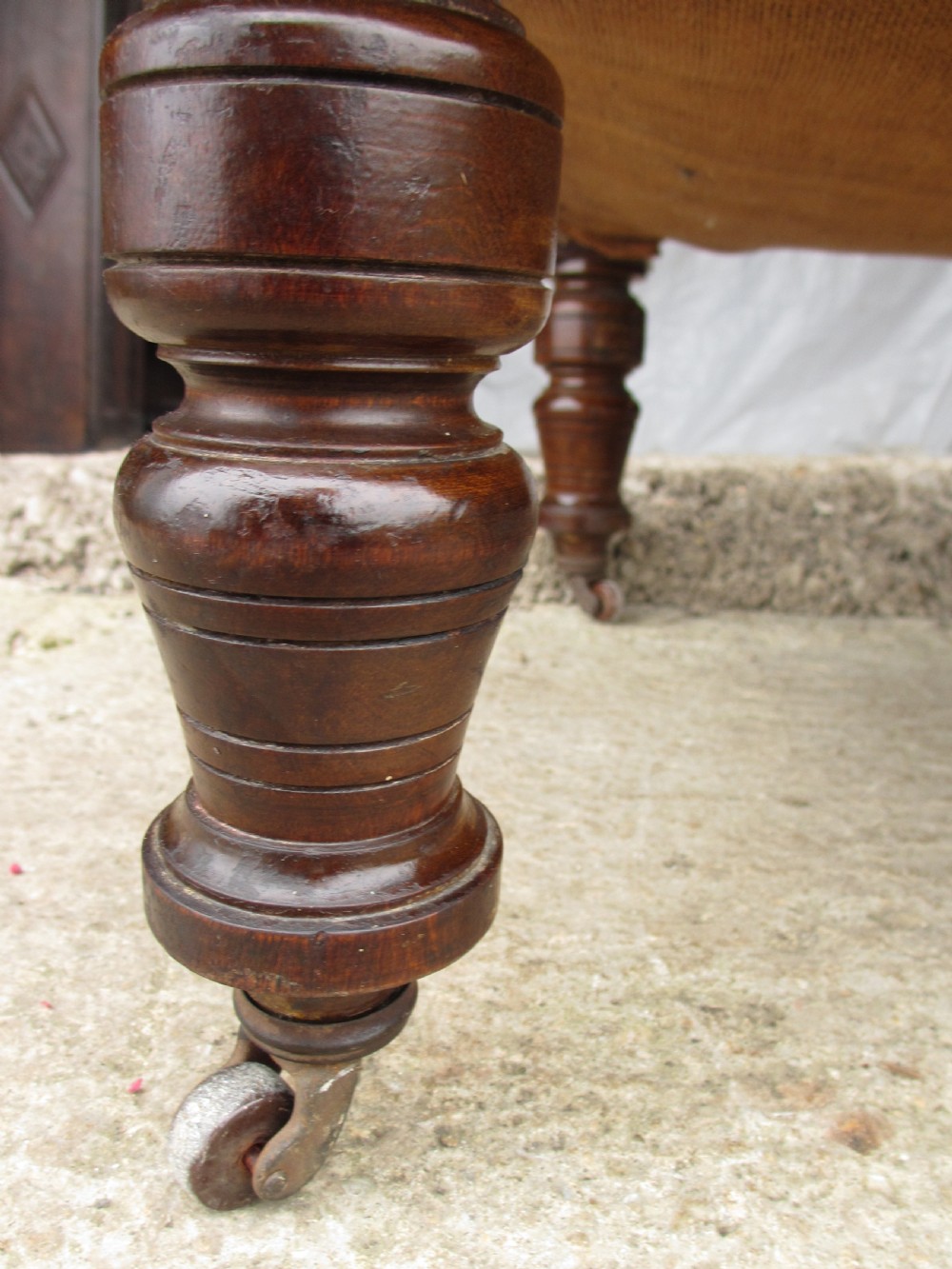 Victorian mahogany upholstered chaise longue turned supports and castors  View VII
