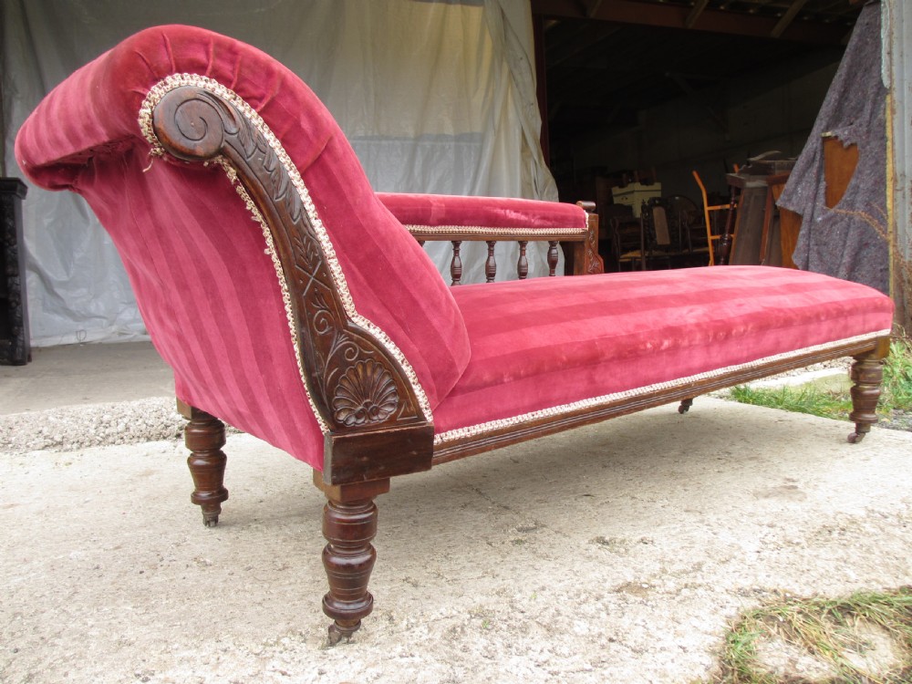 Victorian mahogany upholstered chaise longue turned supports and castors  View IX