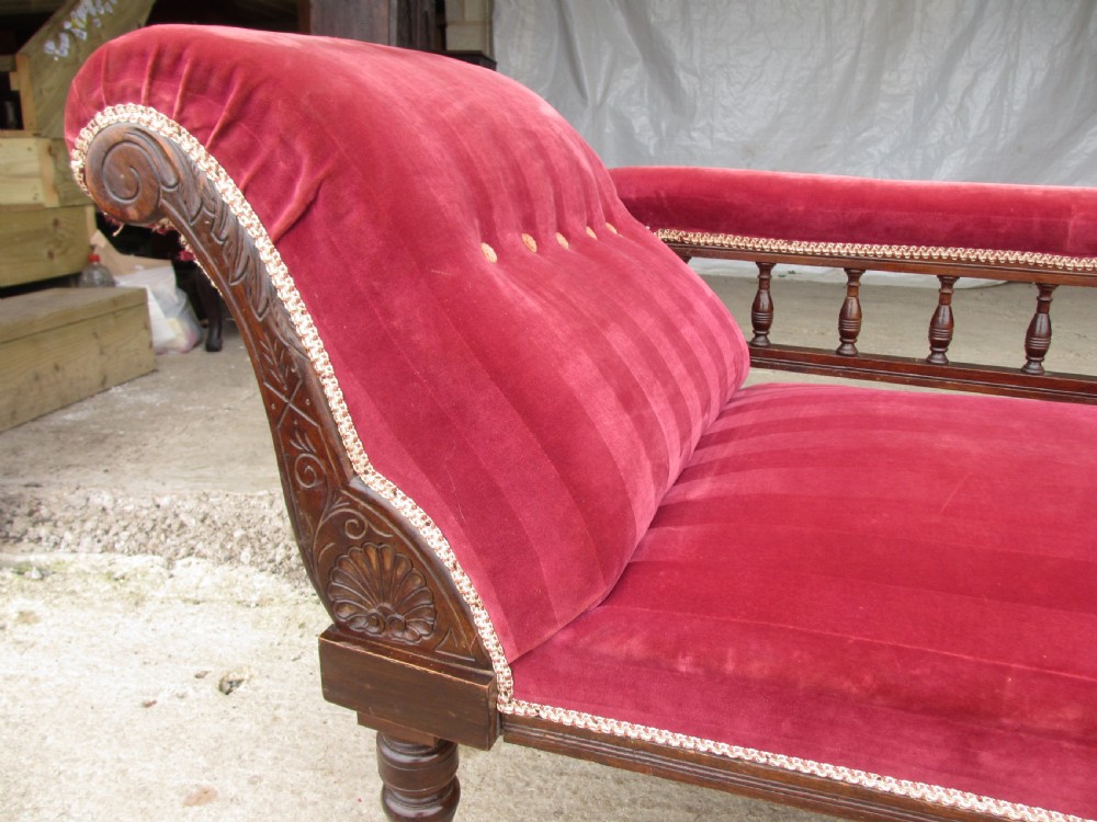 Victorian mahogany upholstered chaise longue turned supports and castors  View X