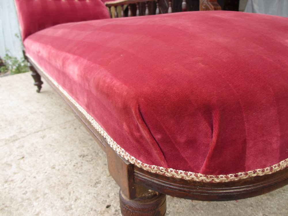 Victorian mahogany upholstered chaise longue turned supports and castors  View XV