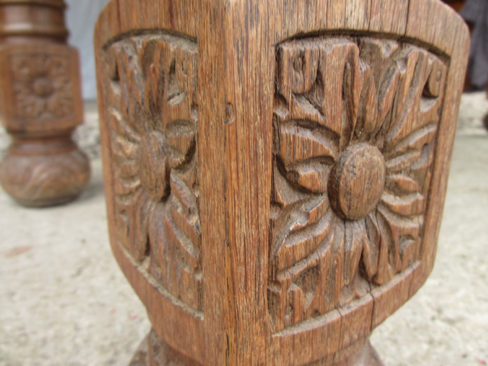 Victorian carved heavy oak dining table with lion heads and floral and leaf frieze on solid oak supports View VII