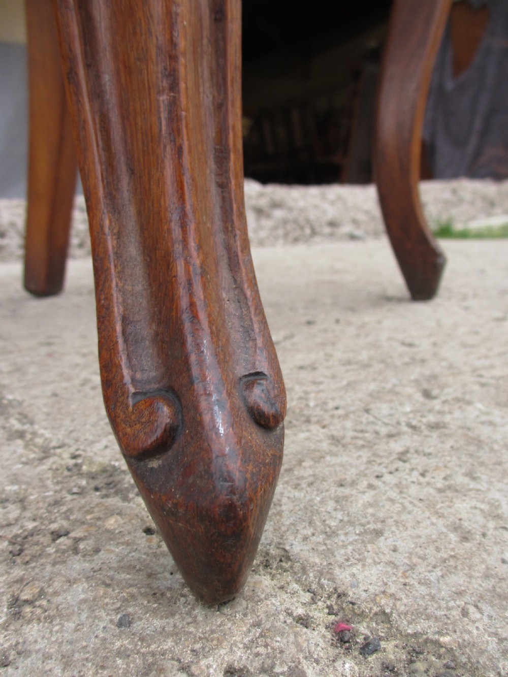 A pair of Victorian carved golden oak hall chairs featuring openwork shield backs with central cartouches, solid wooden seats, and cabriole front legs. View XI