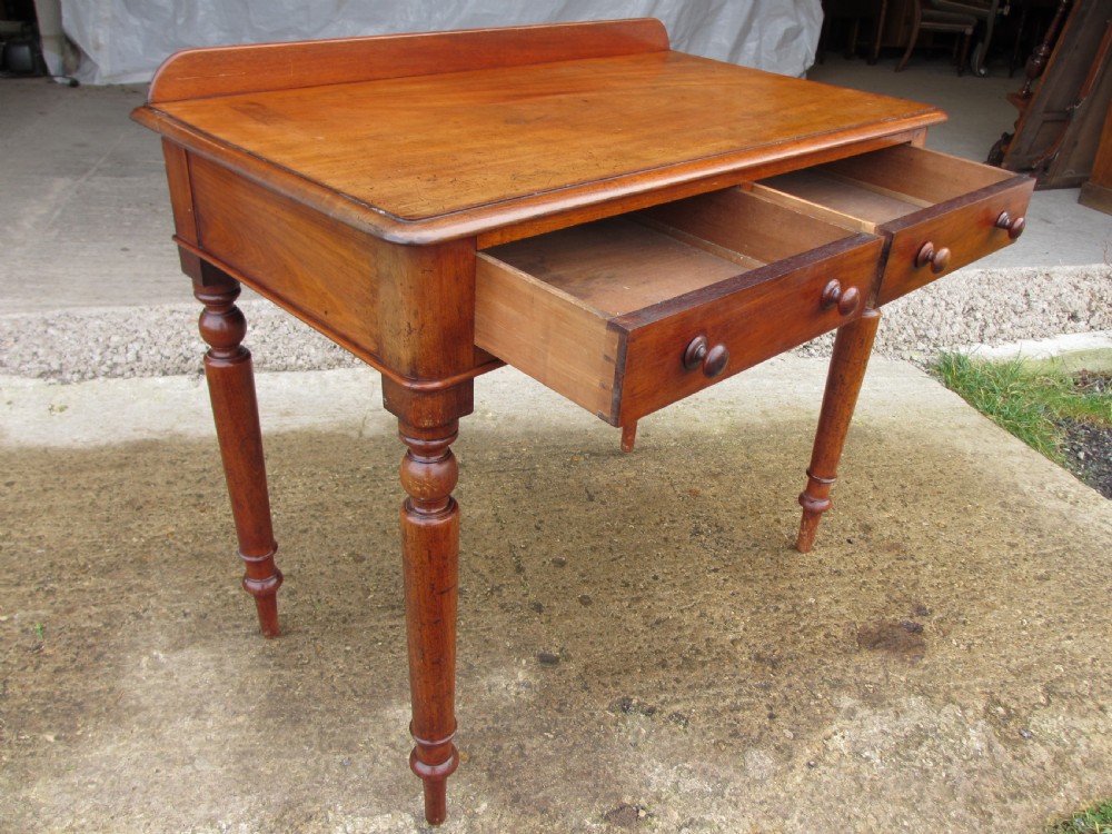 Victorian mahogany twin drawer writing desk on nicely turned supports View IV