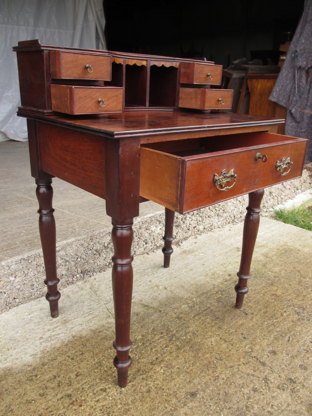 19th Century mahogany stationery backed writing desk on turned supports with one large and 4 small drawers