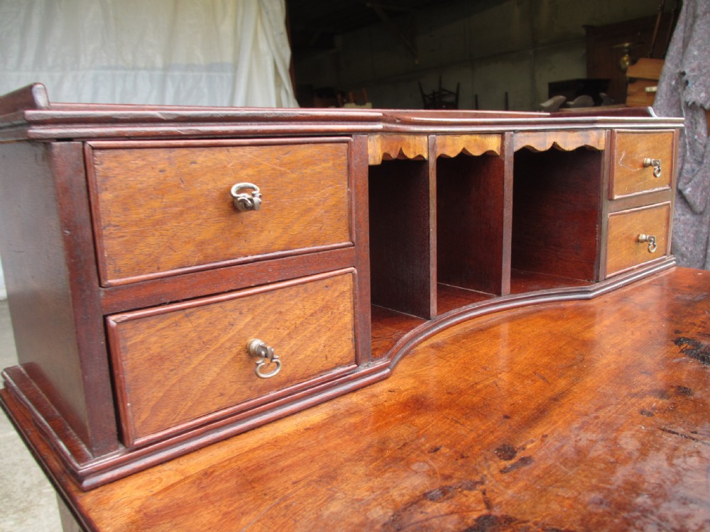 19th Century mahogany stationery backed writing desk on turned supports with one large and 4 small drawers View II