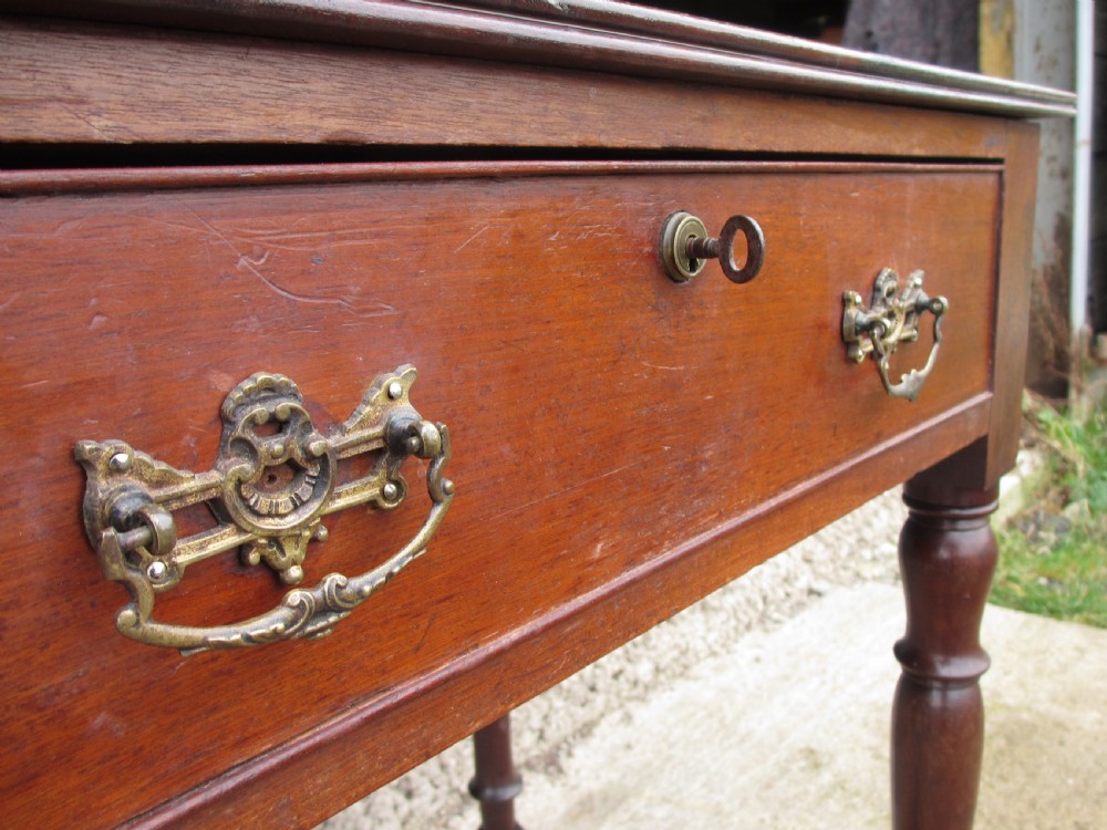 19th Century mahogany stationery backed writing desk on turned supports with one large and 4 small drawers View VI