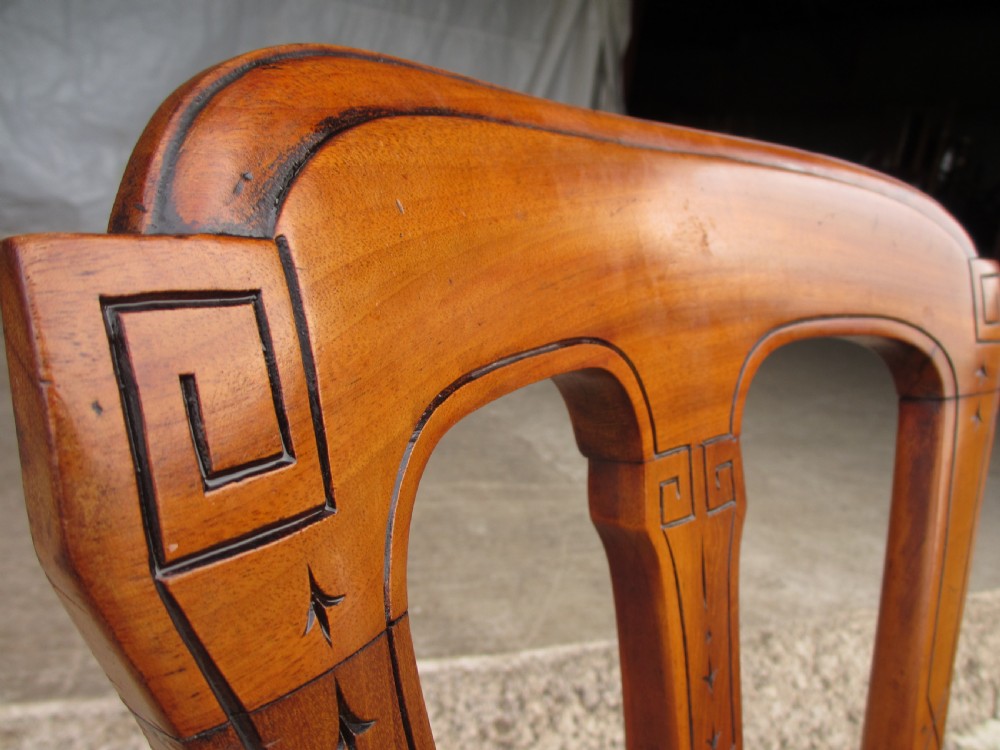 A set of four antique mahogany dining chairs with carved vase splats, inlaid details, turned front legs, and fabric drop-in seats. View VI