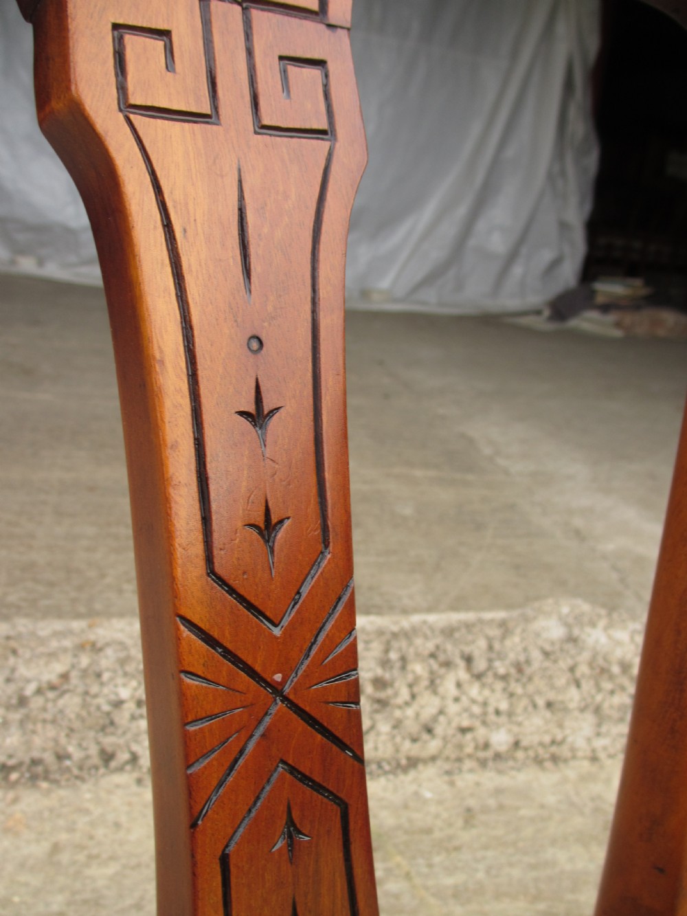 A set of four antique mahogany dining chairs with carved vase splats, inlaid details, turned front legs, and fabric drop-in seats. View VII