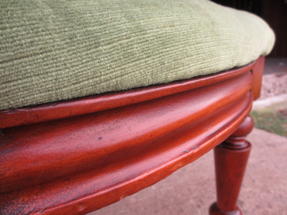 A set of four antique mahogany dining chairs with carved vase splats, inlaid details, turned front legs, and fabric drop-in seats. View VIII