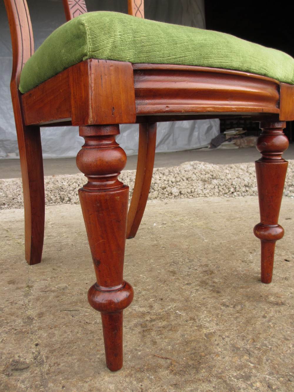 A set of four antique mahogany dining chairs with carved vase splats, inlaid details, turned front legs, and fabric drop-in seats. View IX