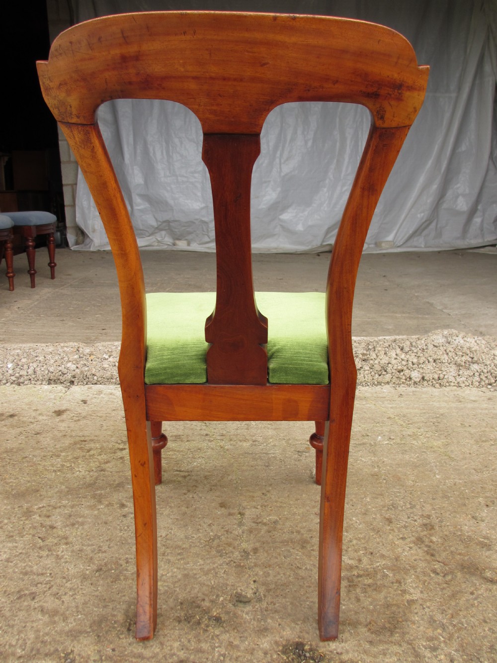 A set of four antique mahogany dining chairs with carved vase splats, inlaid details, turned front legs, and fabric drop-in seats. View XI