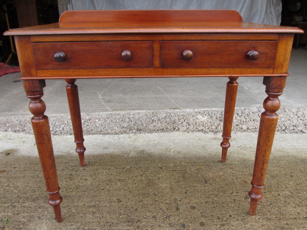 Victorian mahogany twin drawer writing desk on nicely turned supports