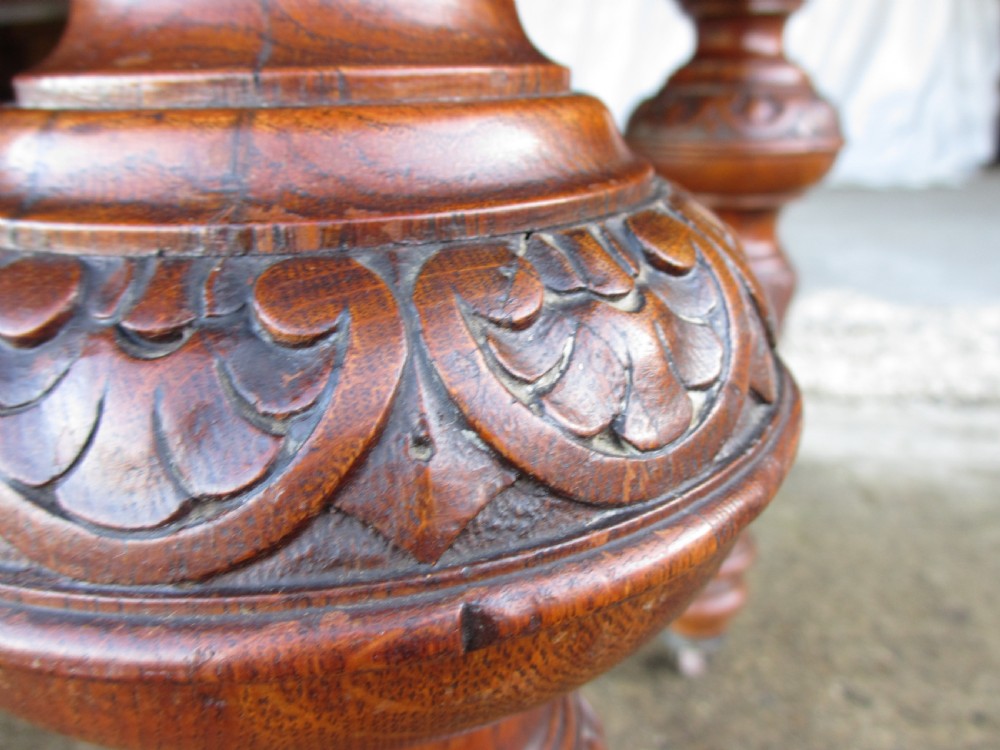 Victorian carved oak dining table with bulbous carved and tapering fluted legs on castors View VIII