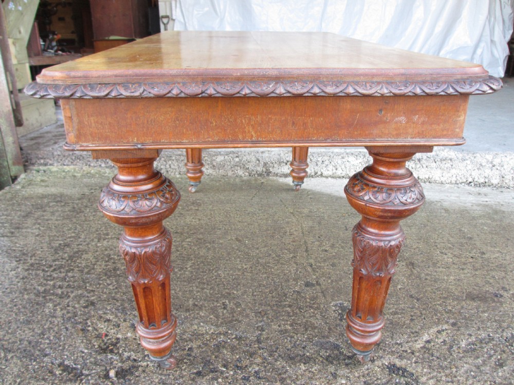 Victorian carved oak dining table with bulbous carved and tapering fluted legs on castors View XI