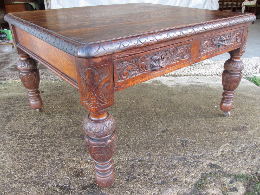 Victorian carved oak green man library writing desk twin drawers carved legs on castors with stops