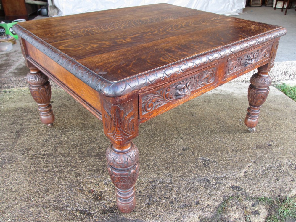 Victorian carved oak green man library writing desk twin drawers carved legs on castors with stops View II