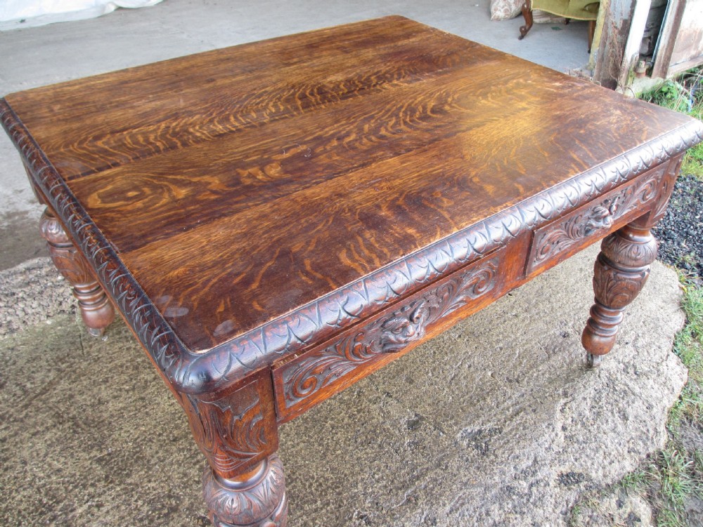 Victorian carved oak green man library writing desk twin drawers carved legs on castors with stops View IV