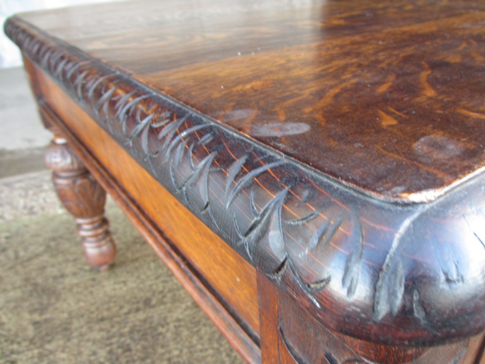 Victorian carved oak green man library writing desk twin drawers carved legs on castors with stops View VI