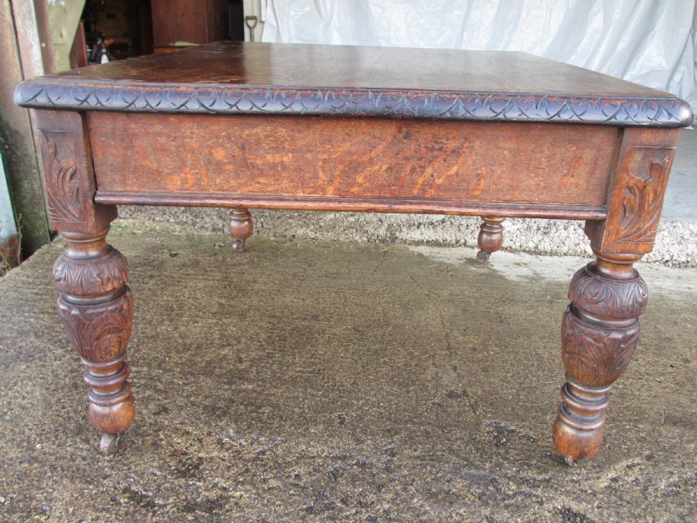 Victorian carved oak green man library writing desk twin drawers carved legs on castors with stops View XVII