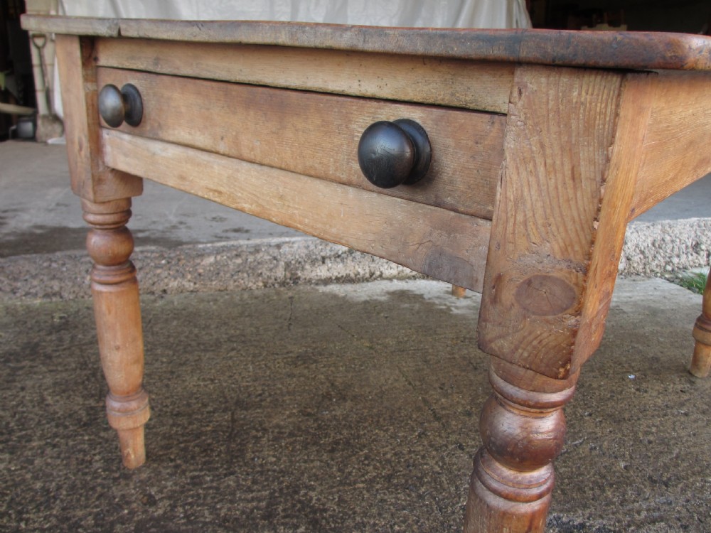 Victorian pine kitchen table with large cutlery drawer on turned legs View II