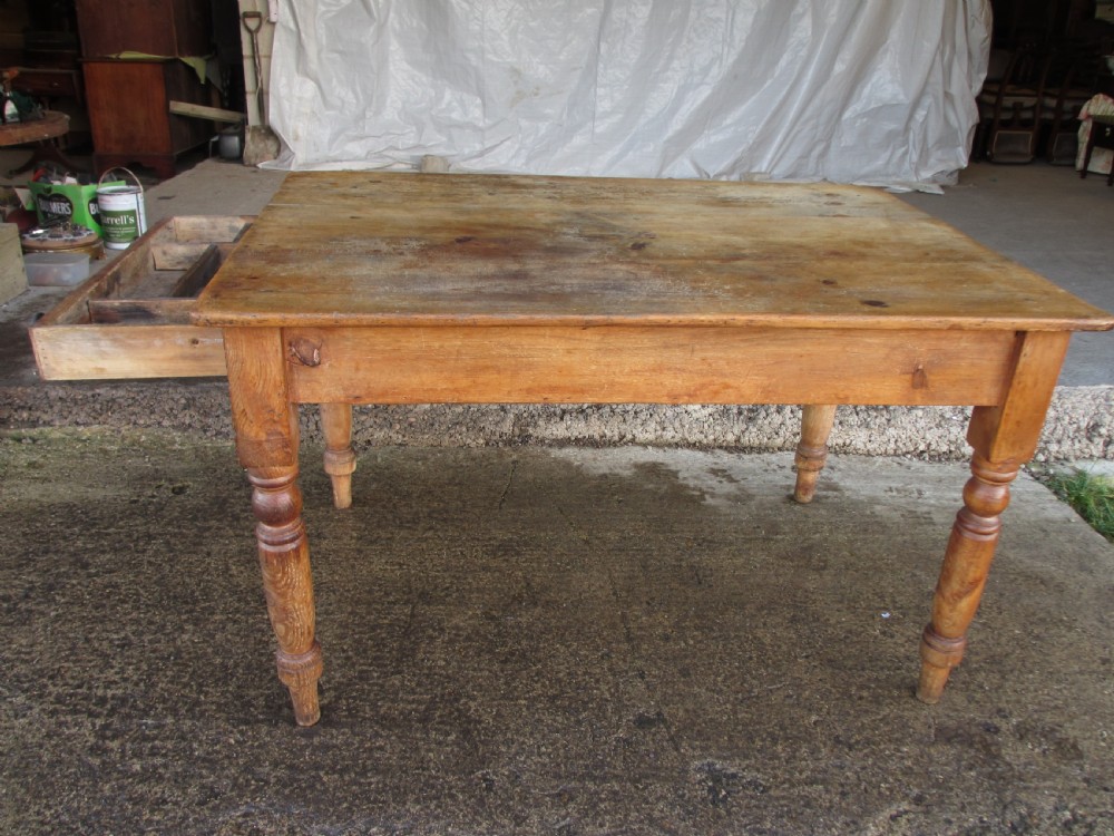 Victorian pine kitchen table with large cutlery drawer on turned legs View XII