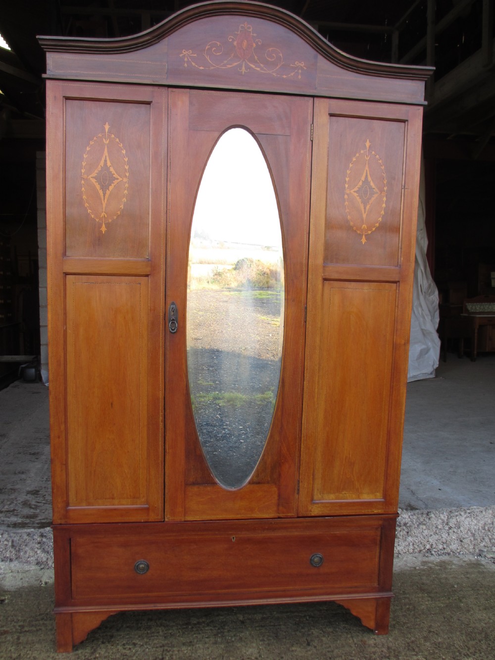Edwardian Mahogany oval mirror inlaid single door wardrobe with key View II