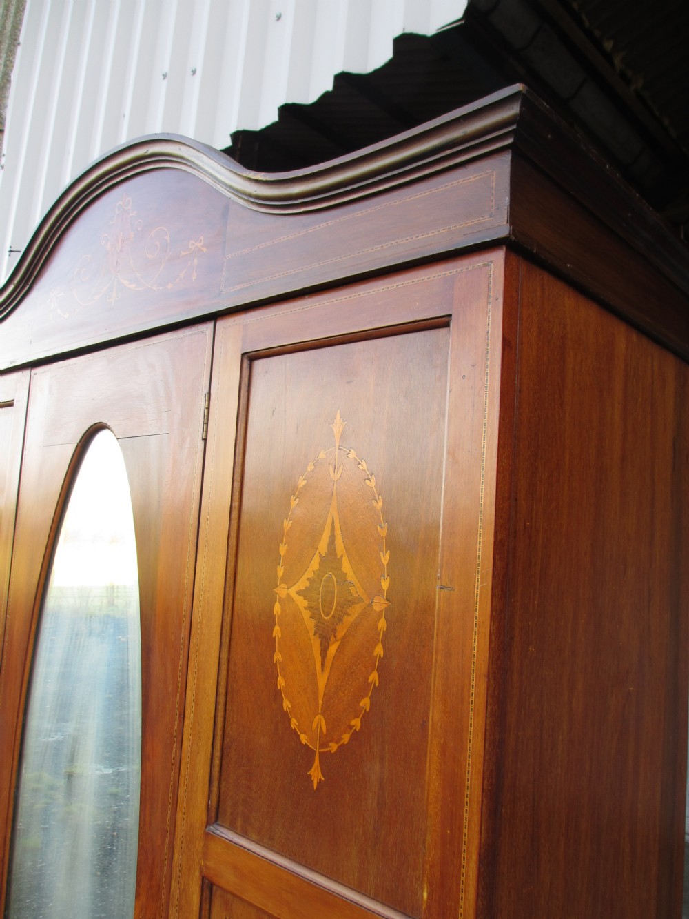 Edwardian Mahogany oval mirror inlaid single door wardrobe with key View III