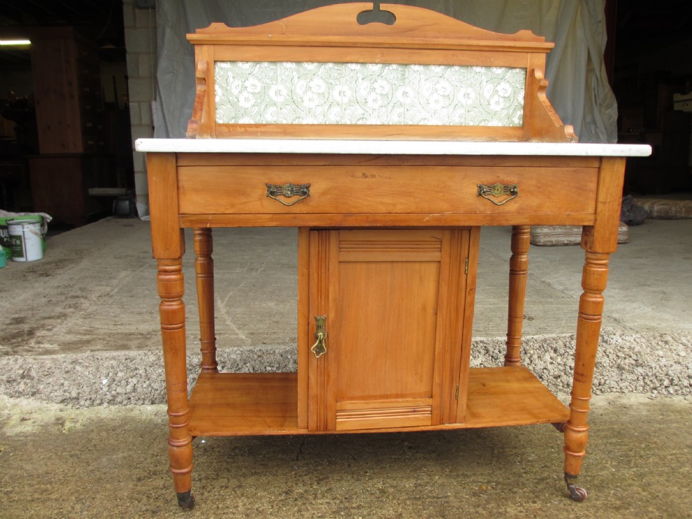 Edwardian satin wood marble topped gallery washstand With drawer on castors