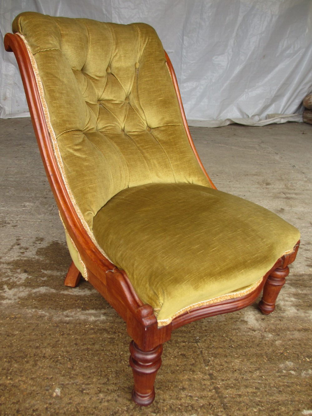 Victorian mahogany serpentine nursing chair Button upholstered Scroll back