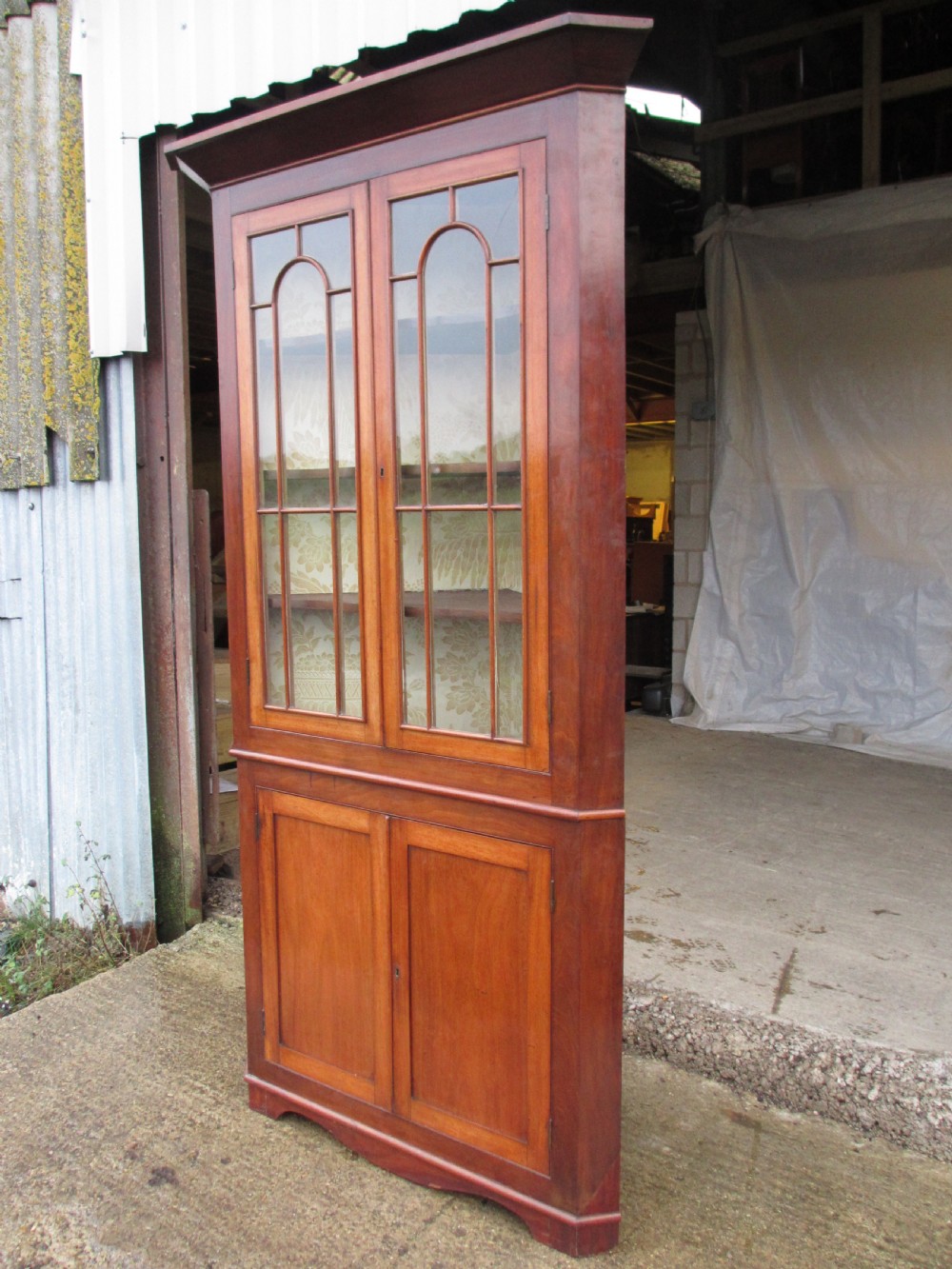 19th C mahogany glazed 2 part corner cabinet with shelves and cupboard