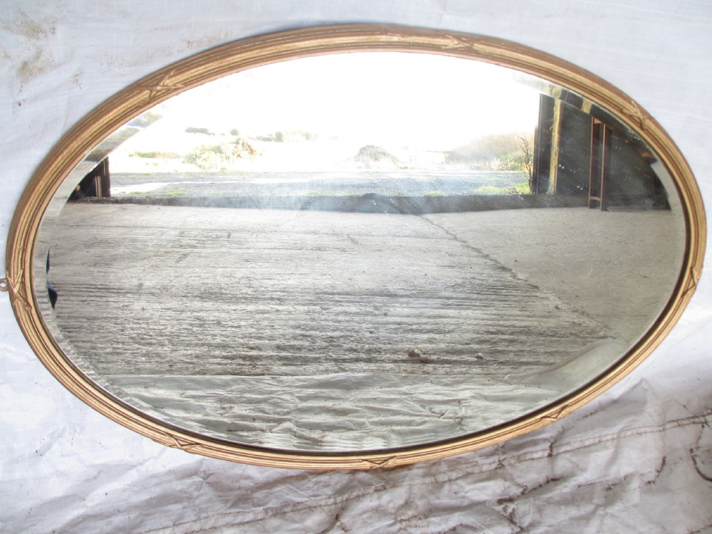 Regency gilt framed oval bevel glass wall hanging mirror 