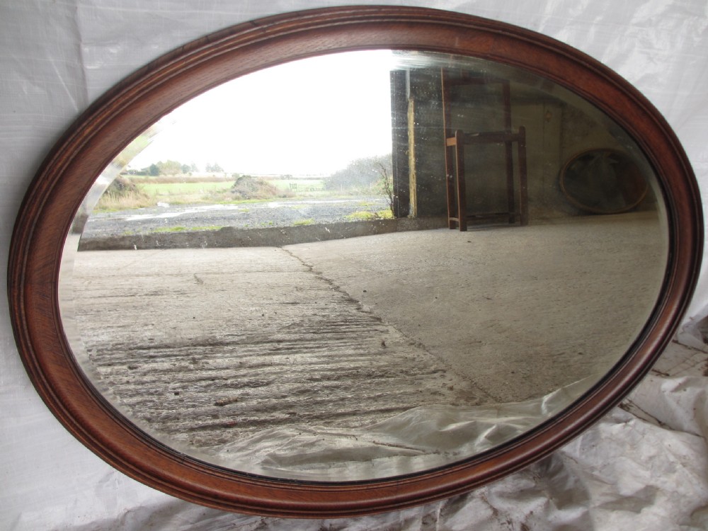 Edwardian Oak framed bevel glass wall mirror