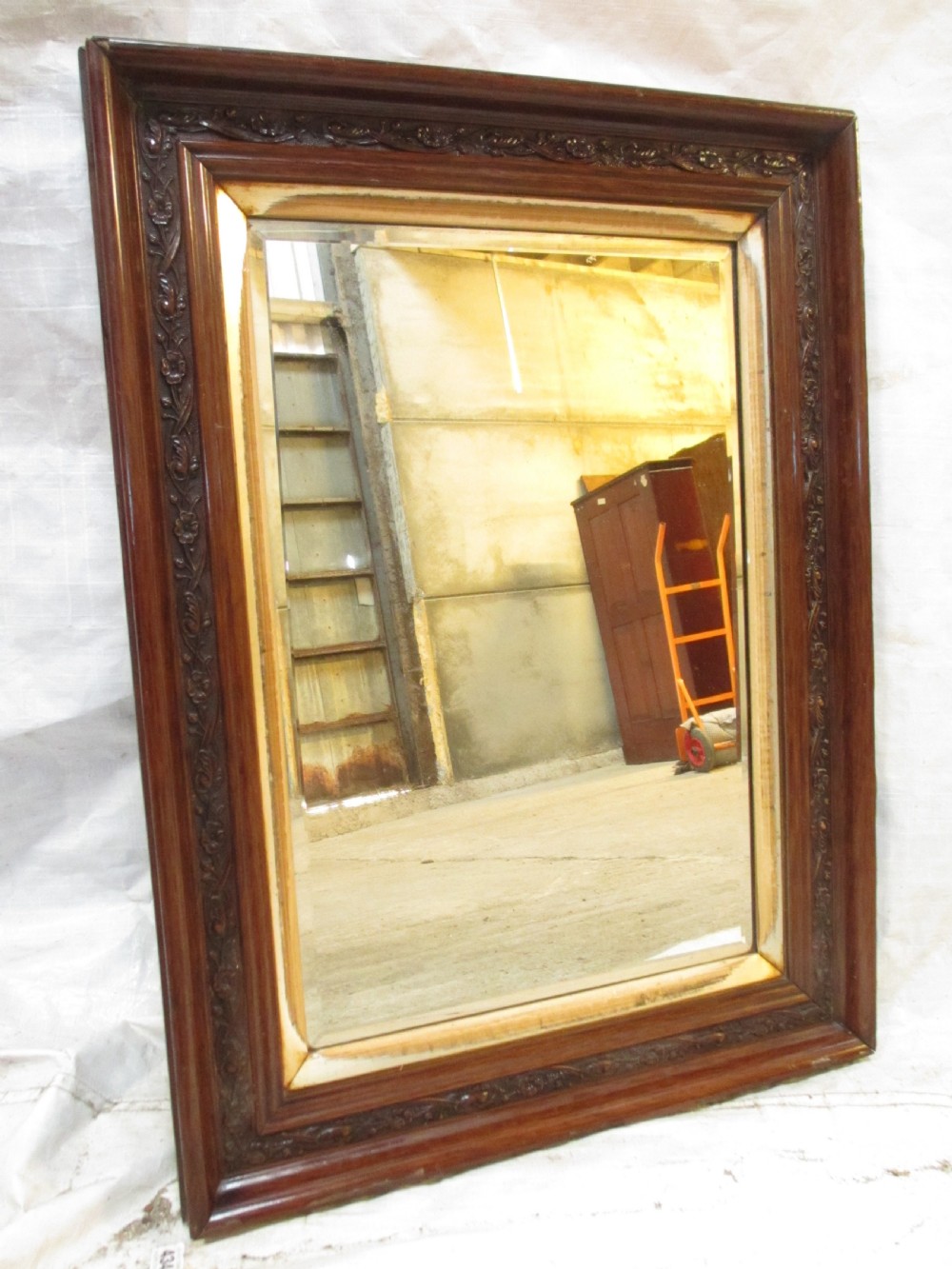 Victorian carved floral mahogany and gilt framed bevel glass wall hanging mirror